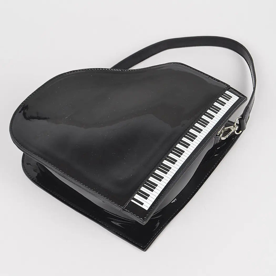 Black grand piano handbag with black strap close-up