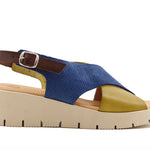 Blue and green wedge with a beige sole, brown heel strap and buckle closure close-up