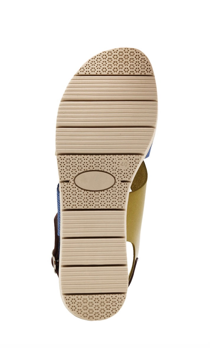 Blue and green wedge with a beige sole, brown heel strap and buckle closure bottom view