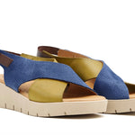 Blue and green wedge with a beige sole, brown heel strap and buckle closure pair