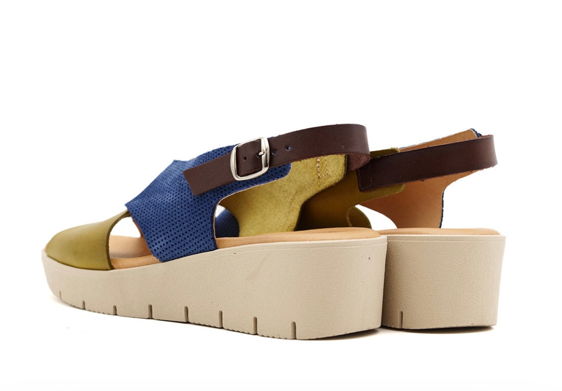 Blue and green wedge with a beige sole, brown heel strap and buckle closure pair heel view