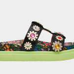 Floral sandal with colorful jewel embellishments and green heel close-up