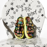 Floral sandal with colorful jewel embellishments and green heel overhead