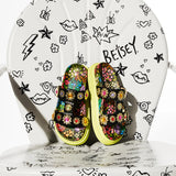 Floral sandal with colorful jewel embellishments and green heel overhead