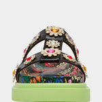 Floral sandal with colorful jewel embellishments and green heel front view
