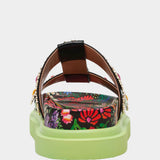 Floral sandal with colorful jewel embellishments and green heel heel view
