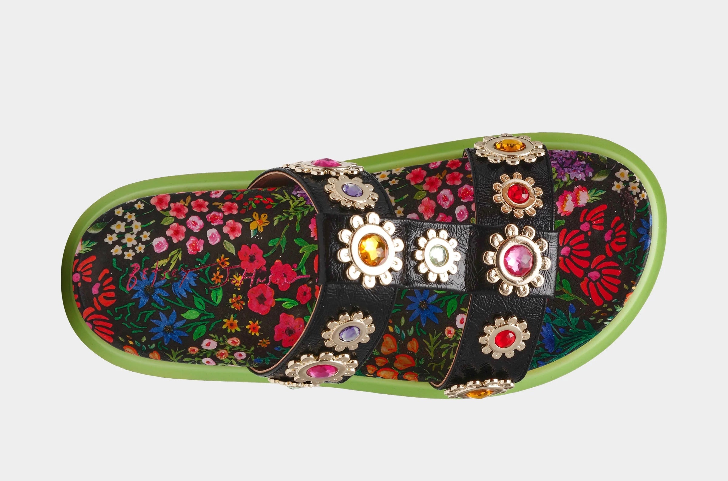 Floral sandal with colorful jewel embellishments and green heel top view