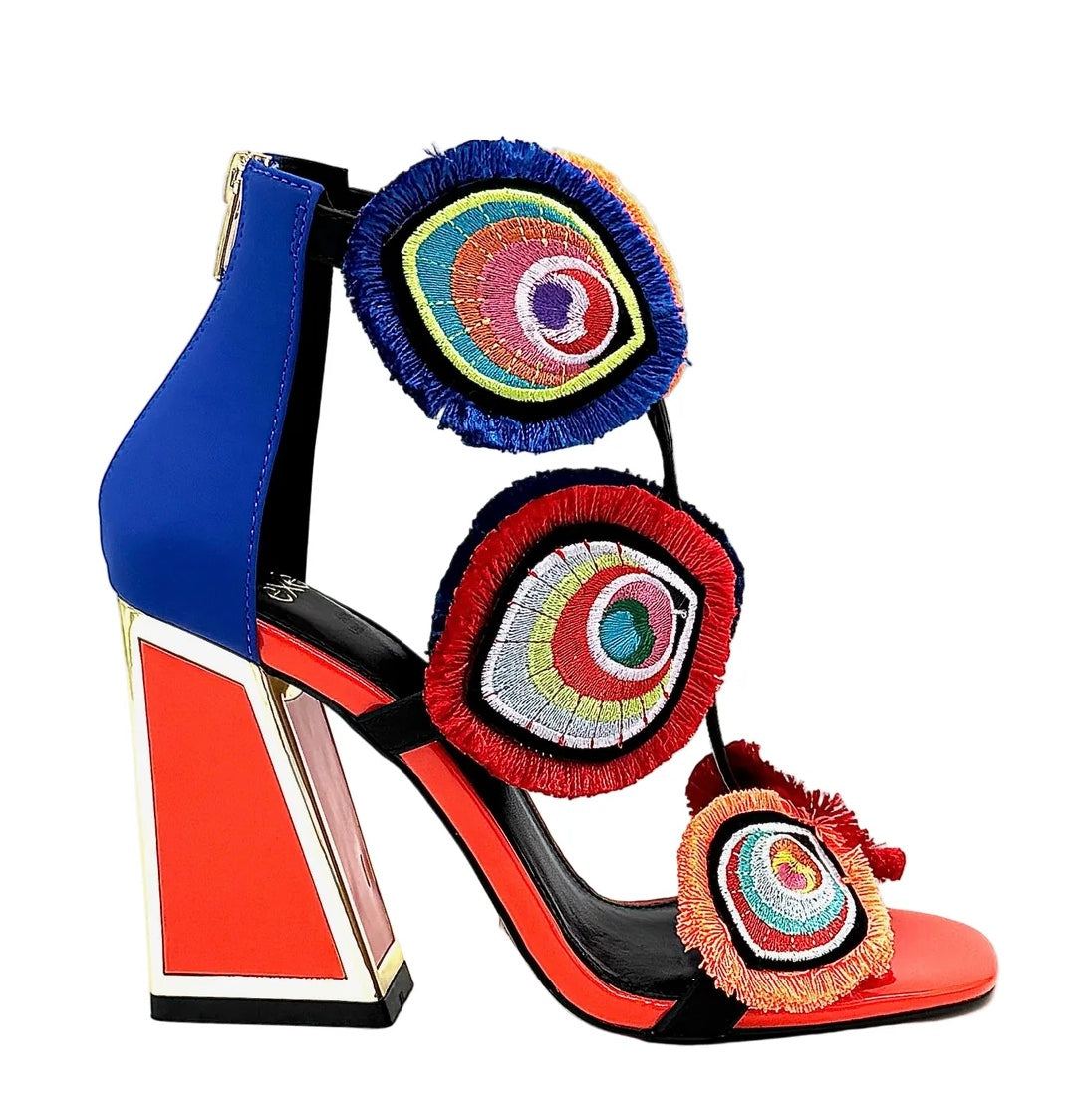 Colorful large heel with three peacock feather elements and zipper closure close-up