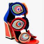 Colorful large heel with three peacock feather elements and zipper closure side view
