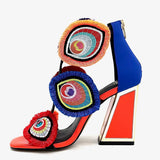 Colorful large heel with three peacock feather elements and zipper closure alternate side view