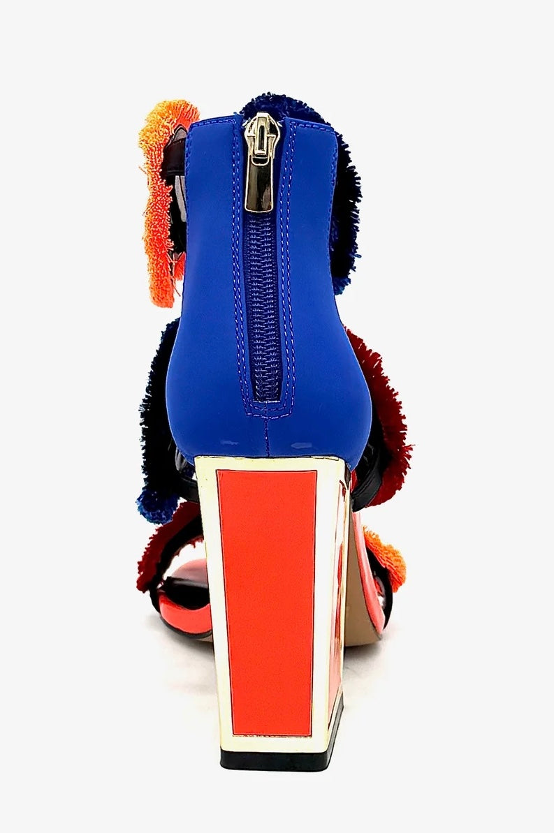 Colorful large heel with three peacock feather elements and zipper closure heel view