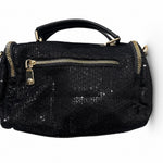 Black handbag with gold accents and decorative elements back
