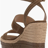 Brown wedge sandal with espadrille sole and buckle closure rear view