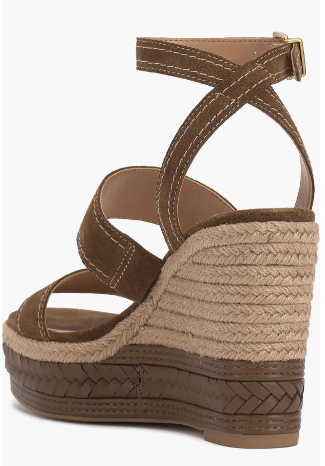 Brown wedge sandal with espadrille sole and buckle closure rear view