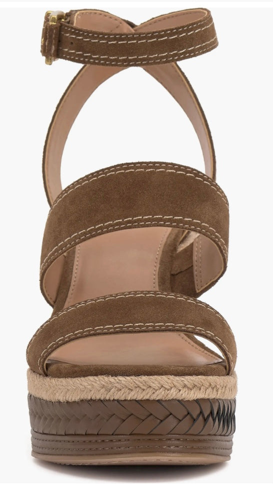 Brown wedge sandal with espadrille sole and buckle closure front view