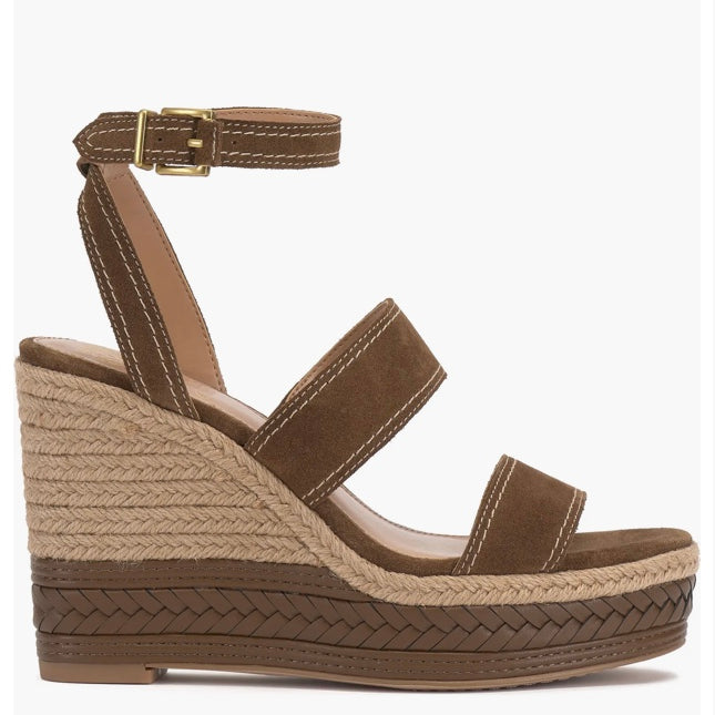 Brown wedge sandal with espadrille sole and buckle closure close-up
