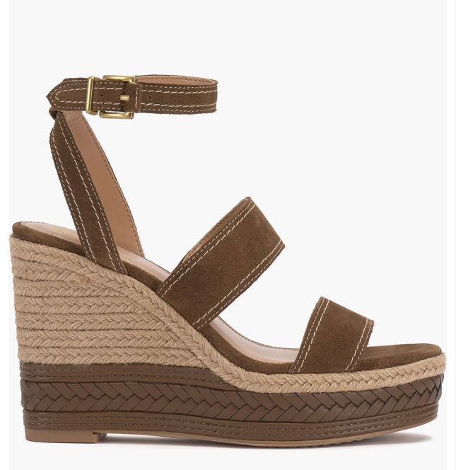 Brown wedge sandal with espadrille sole and buckle closure close-up