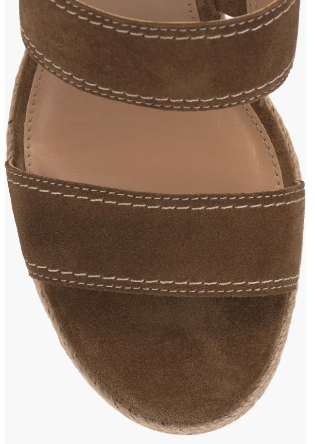 Brown wedge sandal with espadrille sole and buckle closure toe box