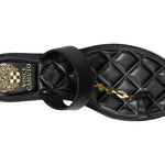 Black sandal with a gold chain with small heel overhead