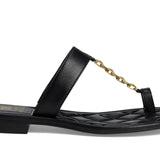 Black sandal with a gold chain with small heel close-up