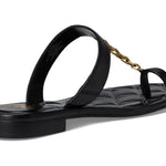 Black sandal with a gold chain with small heel rear view