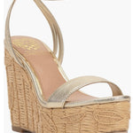 Beige wedge sandal with gold metallic straps and buckle closure side view