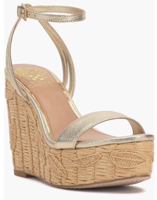 Beige wedge sandal with gold metallic straps and buckle closure side view
