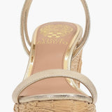 Beige wedge sandal with gold metallic straps and buckle closure front view