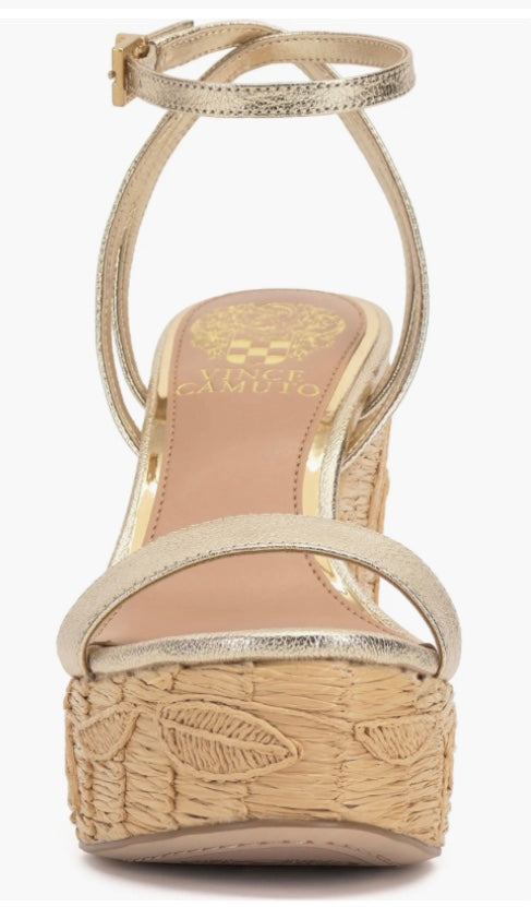 Beige wedge sandal with gold metallic straps and buckle closure front view