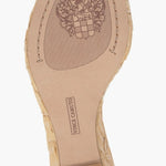 Beige wedge sandal with gold metallic straps and buckle closure bottom view