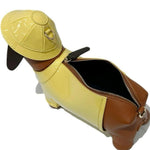 Dog-shaped bag with a yellow body and brown ears and tail back open