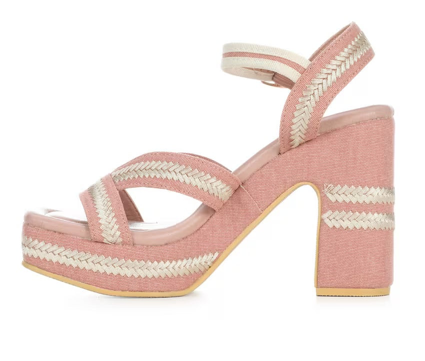 Pink heel with woven white straps inside view