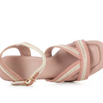 Pink heel with woven white straps top view