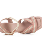 Pink heel with woven white straps top view