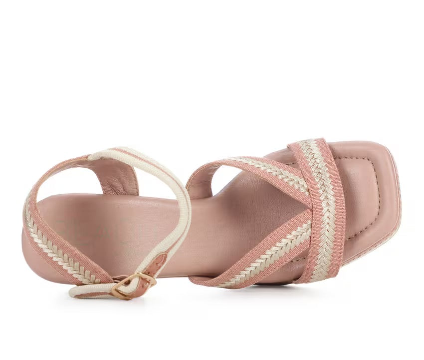 Pink heel with woven white straps top view