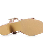 Pink heel with woven white straps sole view