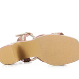 Pink heel with woven white straps sole view