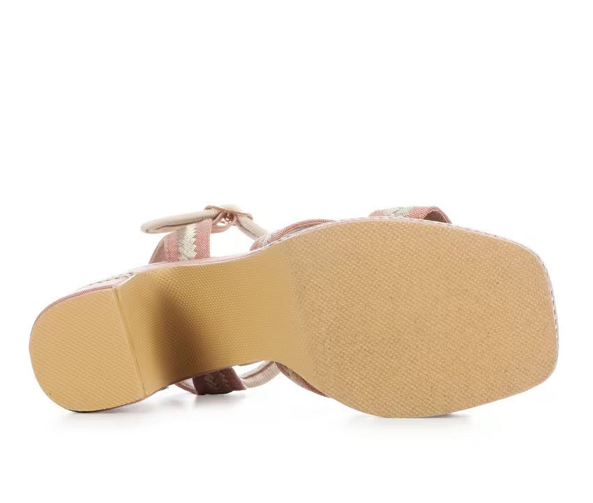 Pink heel with woven white straps sole view