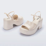 White platform heel with white strap and buckle closure pair