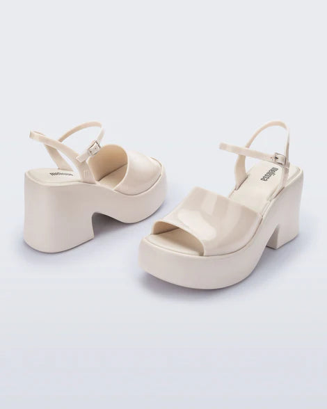 White platform heel with white strap and buckle closure pair