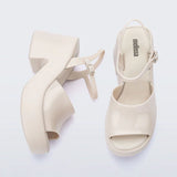 White platform heel with white strap and buckle closure top & side view