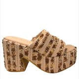 Textured brown high-heeled shoe close-up