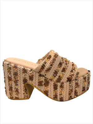 Textured brown high-heeled shoe close-up