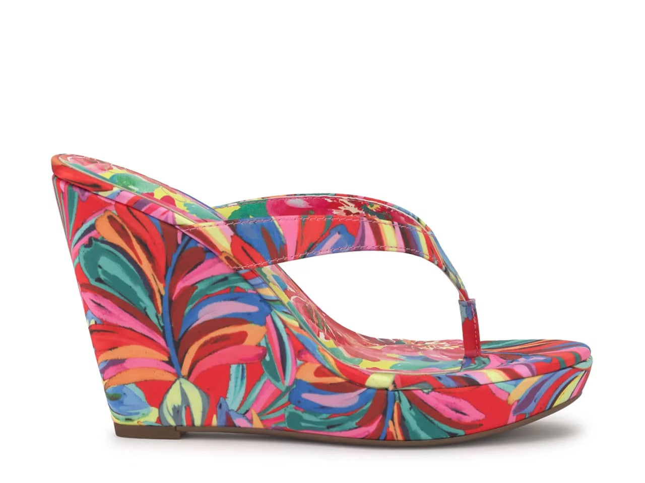 Colorful wedge sandal with a vibrant paint inspired floral pattern close up