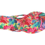 Colorful wedge sandal with a vibrant paint inspired floral pattern top view