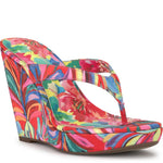 Colorful wedge sandal with a vibrant paint inspired floral pattern side view