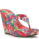 Colorful wedge sandal with a vibrant paint inspired floral pattern side view