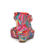 Colorful wedge sandal with a vibrant paint inspired floral pattern from back