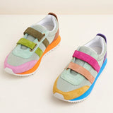Multicolored velcro sneaker with orange sole pair front view