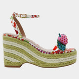 Colorful raffi green striped wedge sandal with with fruit strap and strawberry embellishment close up